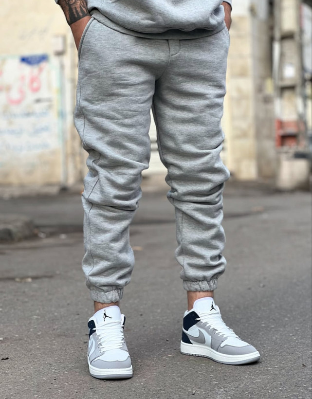 شلوار جاگر طوسی ملانژ پارچه دورس خار خورده | استایل فوقالعاده شیک ۲۰۲۵