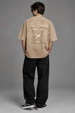 تیشرت لش فول باکسی مردانه کرم پارچه دورس دونخ با چاپ مینیمال L110 / اورجینال دیلم